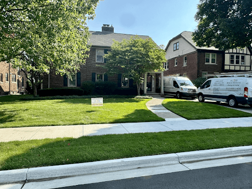 McCarver Mechanical Heating & Cooling van parked in brick home’s driveway while delivering Clinton Township Furnace repair