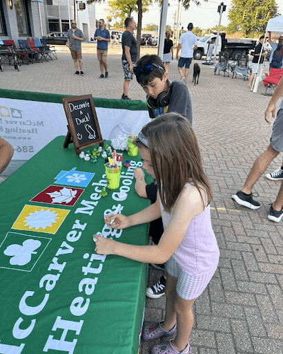 Happy decorating ducks at a local event in Warren