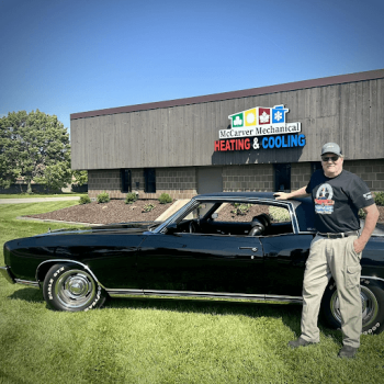 Company owner of McCarver Mechanical Heating & Cooling showing off a classic car